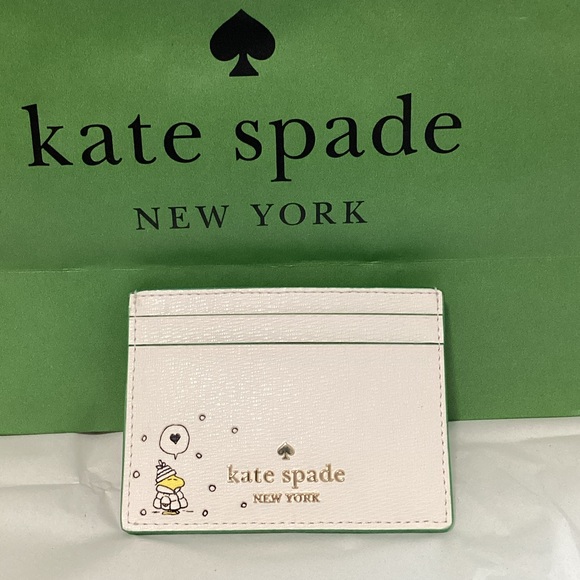 kate spade Accessories - Peanuts x Kate Spade Cream Card Holder